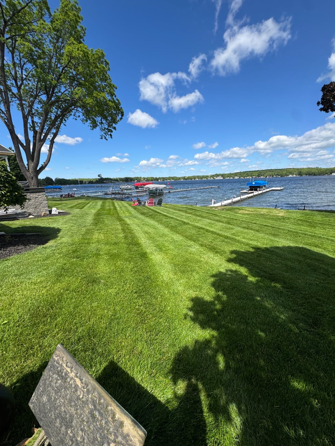 Striped lakeside lawn with docks and waterfront view